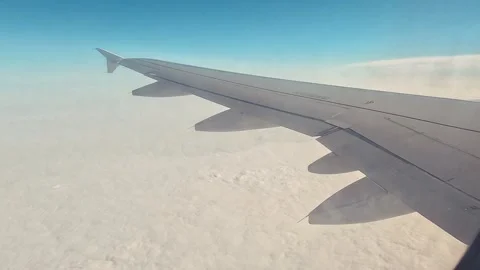 Sky Airplane Passenger Window And Wings And Clouds Stock Footage 339971607