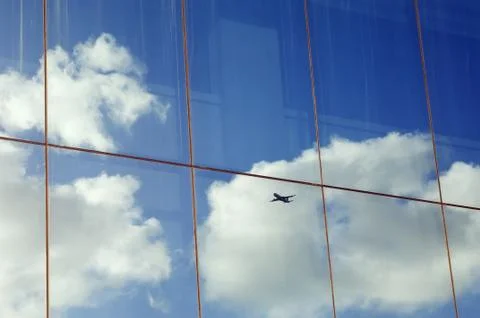 Sky with airplane reflection Stock Photos