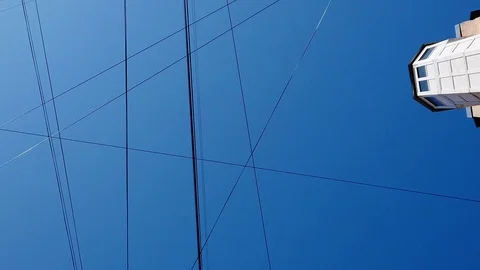 Sky and buildings with a web of wires Stock Footage 117065500