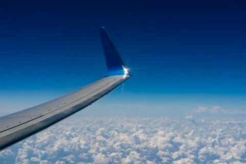 Sky and cloud as seen through window of an aircraft. Stock Photos