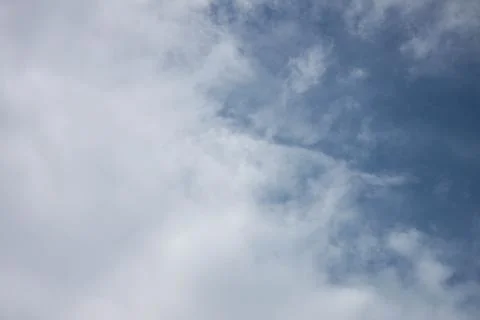 Sky and clouds covered each half. Stock Photos