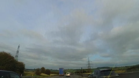 Sky and Clouds During Car Drive over England GB UK Stock Footage 320372464