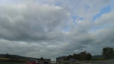 Sky and Clouds During Car Drive over England GB UK Stock Footage 320372676