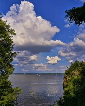 Sky and clouds with lake between the trees , the river background. Stock Photos