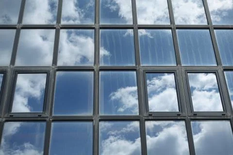 Sky and clouds reflected on building windows Stock-Fotos