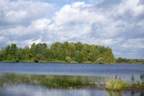 Sky and clouds reflection on Lake . Stock Photos