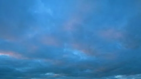 Sky and clouds at sunset. Different shades cloud with color sky. Timelapse. Stock Photos