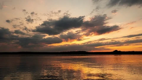 Sky and clouds at sunset over the lake shore. Beautiful, dramatic cloudy sky Stock Footage 272739352