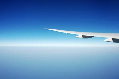 Sky and clouds Through Flight Window Stock Photos