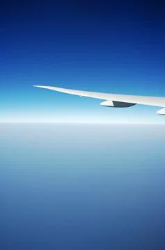 Sky and clouds Through Flight Window Stock Photos