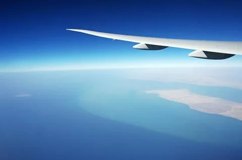 Sky and clouds Through Flight Window Stock Photos