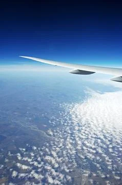 Sky and clouds Through Flight Window Stock Photos