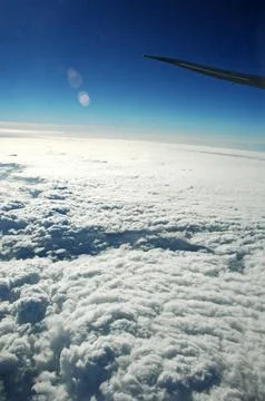 Sky and clouds Through Flight Window Stock Photos