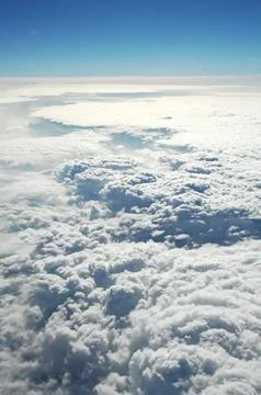 Sky and clouds Through Flight Window Stock Photos