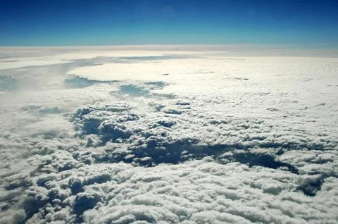 Sky and clouds Through Flight Window Stock Photos