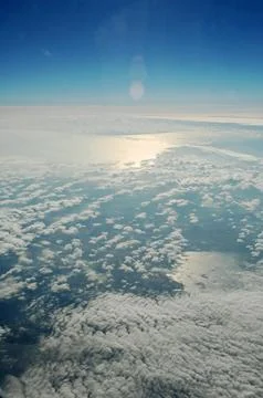 Sky and clouds Through Flight Window Stock Photos