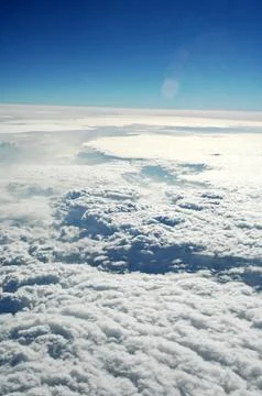 Sky and clouds Through Flight Window Stock Photos