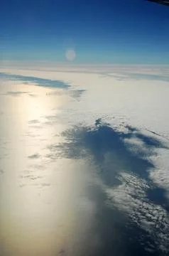 Sky and clouds Through Flight Window Stock Photos
