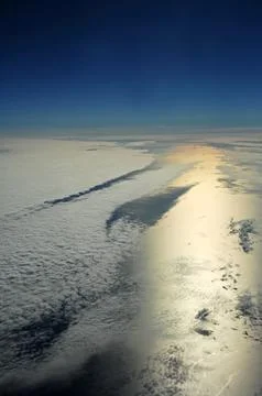 Sky and clouds Through Flight Window Stock Photos