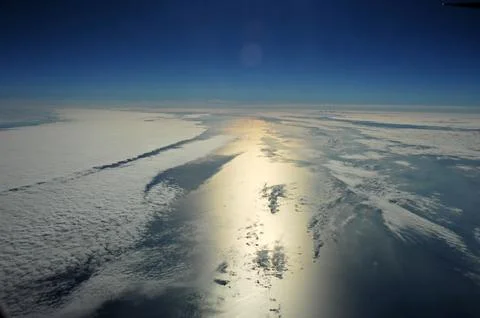 Sky and clouds Through Flight Window Stock Photos