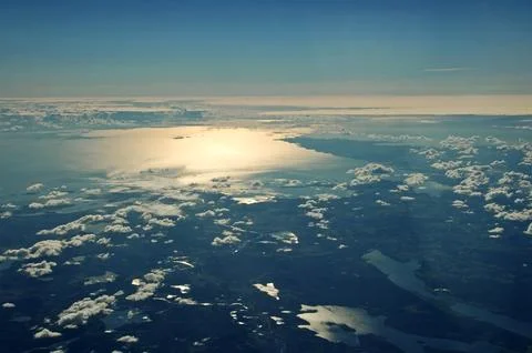 Sky and clouds Through Flight Window Stock Photos
