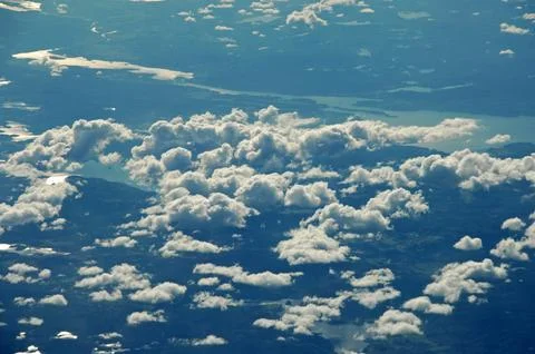 Sky and clouds Through Flight Window Stock Photos