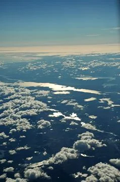 Sky and clouds Through Flight Window Stock Photos