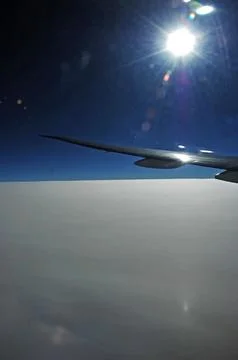 Sky and clouds Through Flight Window Stock Photos