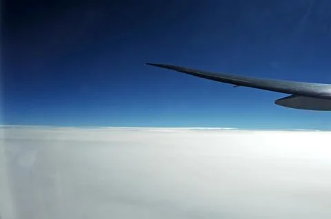 Sky and clouds Through Flight Window Stock Photos