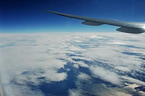 Sky and clouds Through Flight Window Stock Photos