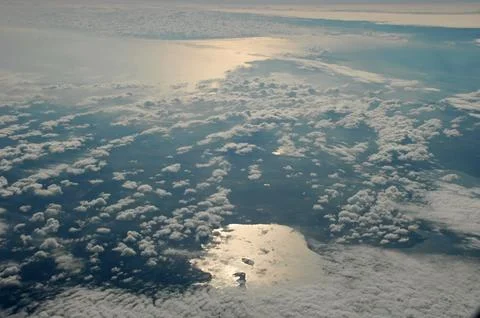 Sky and clouds Through Flight Window Stock Photos