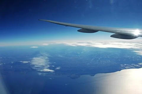 Sky and clouds Through Flight Window Stock Photos