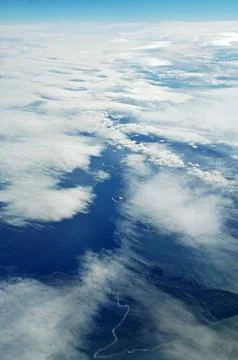 Sky and clouds Through Flight Window Stock Photos