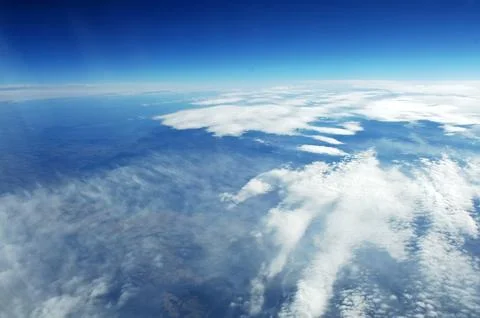 Sky and clouds Through Flight Window Stock Photos