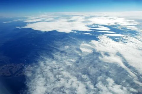 Sky and clouds Through Flight Window Stock Photos