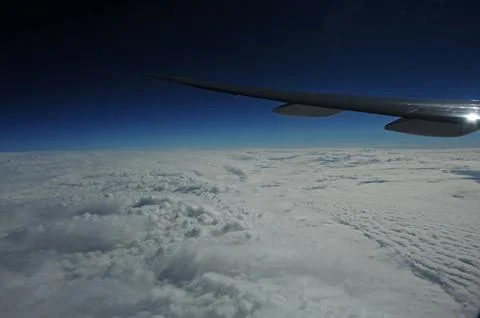 Sky and clouds Through Flight Window Stock Photos