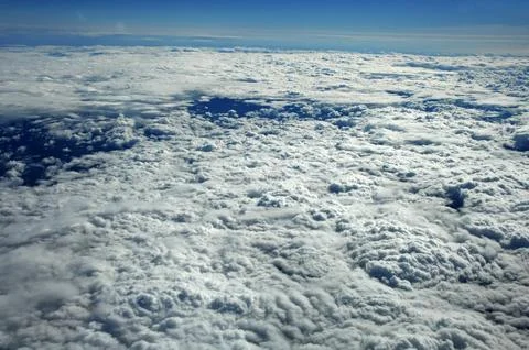 Sky and clouds Through Flight Window Stock Photos