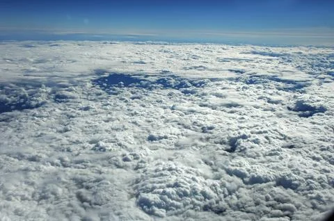 Sky and clouds Through Flight Window Stock Photos