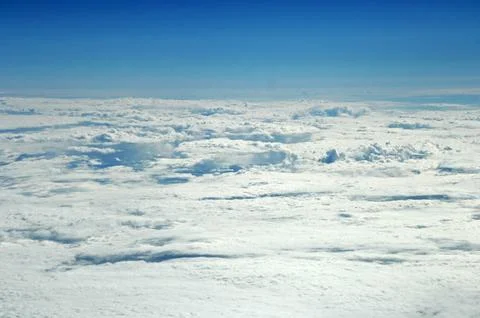 Sky and clouds Through Flight Window Stock Photos