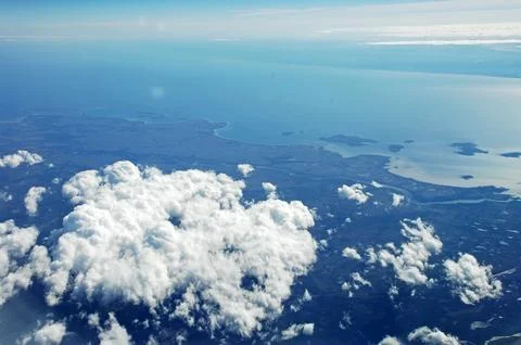 Sky and clouds Through Flight Window Stock Photos