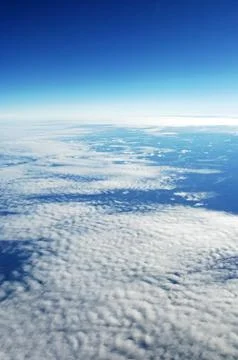 Sky and clouds Through Flight Window Stock Photos