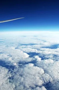 Sky and clouds Through Flight Window Stock Photos