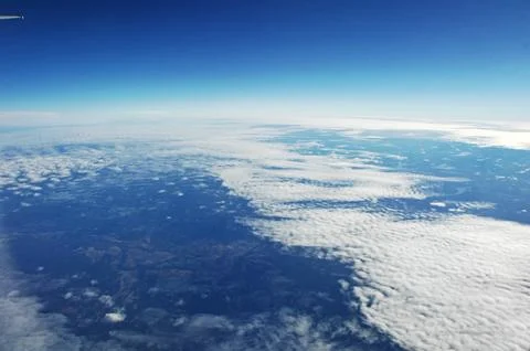 Sky and clouds Through Flight Window Stock Photos