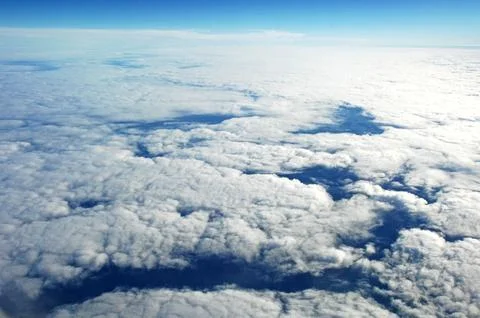 Sky and clouds Through Flight Window Stock Photos