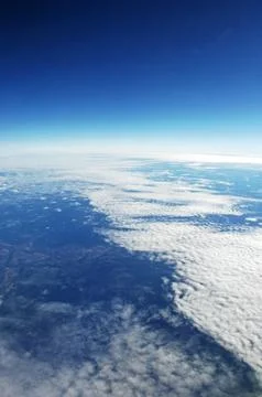Sky and clouds Through Flight Window Stock Photos