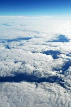 Sky and clouds Through Flight Window Stock Photos
