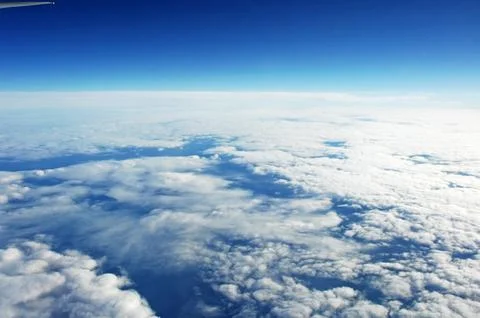 Sky and clouds Through Flight Window Stock Photos