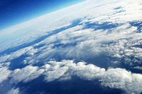 Sky and clouds Through Flight Window Stock Photos