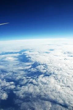 Sky and clouds Through Flight Window Stock Photos