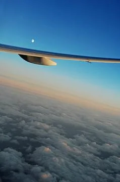 Sky and clouds Through Flight Window Stock Photos